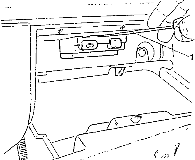 Illustration showing hand applying pressure to remove a plastic strip from the glovebox light assembly.
